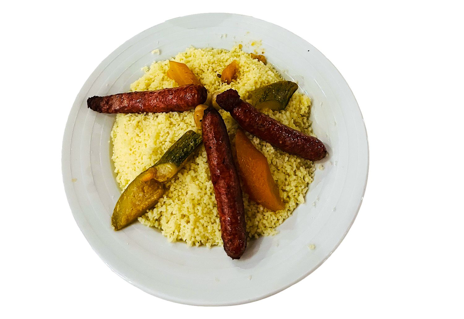 Illallisella voi nauttia tyypillisiä Algerian ruokia: lihaa ja kuskusia.
